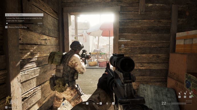 A screenshot of Delta Force, showing players taking cover in a wooden shack in the Black Hawk Down campaign.