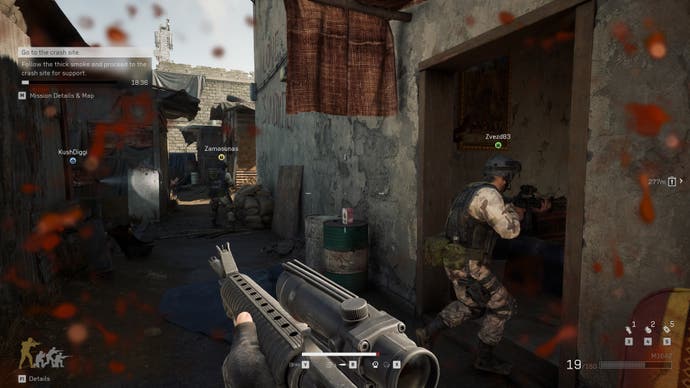 A screenshot of Delta Force, showing players coordinating to clear a building in the Black Hawk Down campaign.