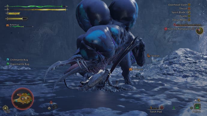 A hunter wades through sludge fighting a Rompopolo monster in Monster Hunter Wilds.