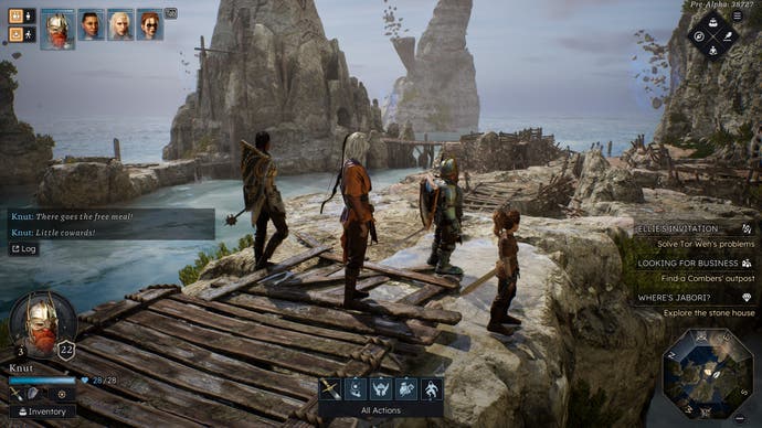 A group of fantasy heroes stands on a rock with some wooden boards on, overlooking a rocky beachfront scene.