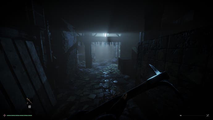 A screenshot from Total Chaos showing a murky corridor with broken tables and detritus strewn everywhere. In the nearground we see a character's hands holding a pickaxe.