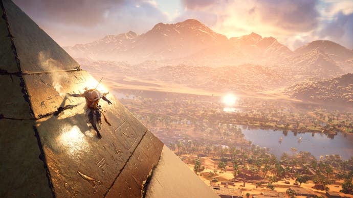 Bayek slides down the side of a Pyramid in Assassin's Creed Origins.