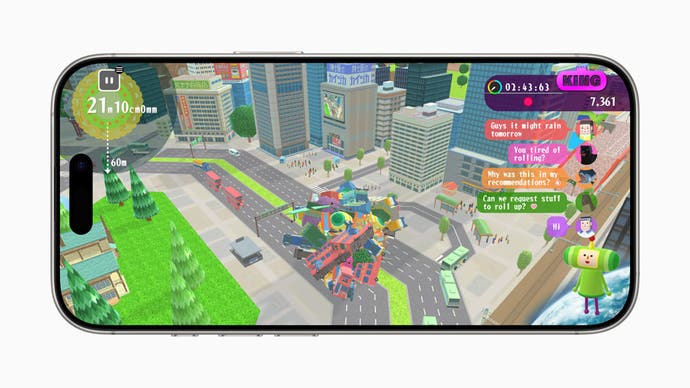 Image of an iPhone showing colourful gameplay of ball of junk rolling through a city in Katamari Damacy