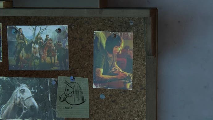 Screenshot from TLOU2 showing a pinbord with pictures and photos on it including one of Cat