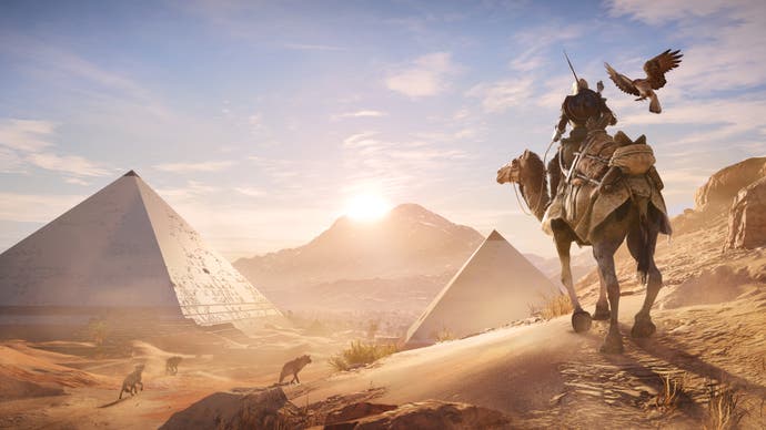 Bayek rides a camel while looking at the Pyramids in Assassin's Creed Origins