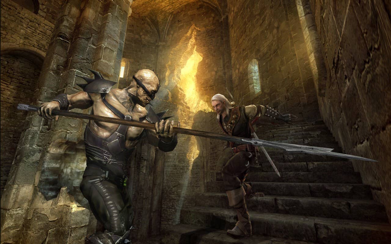 Two characters fight on the stairs of a castle. One is a twisted-looking human in what appears to be bondage-like wear, and the other is a white-haired human in leather armour. That's Geralt. He's a goodie.