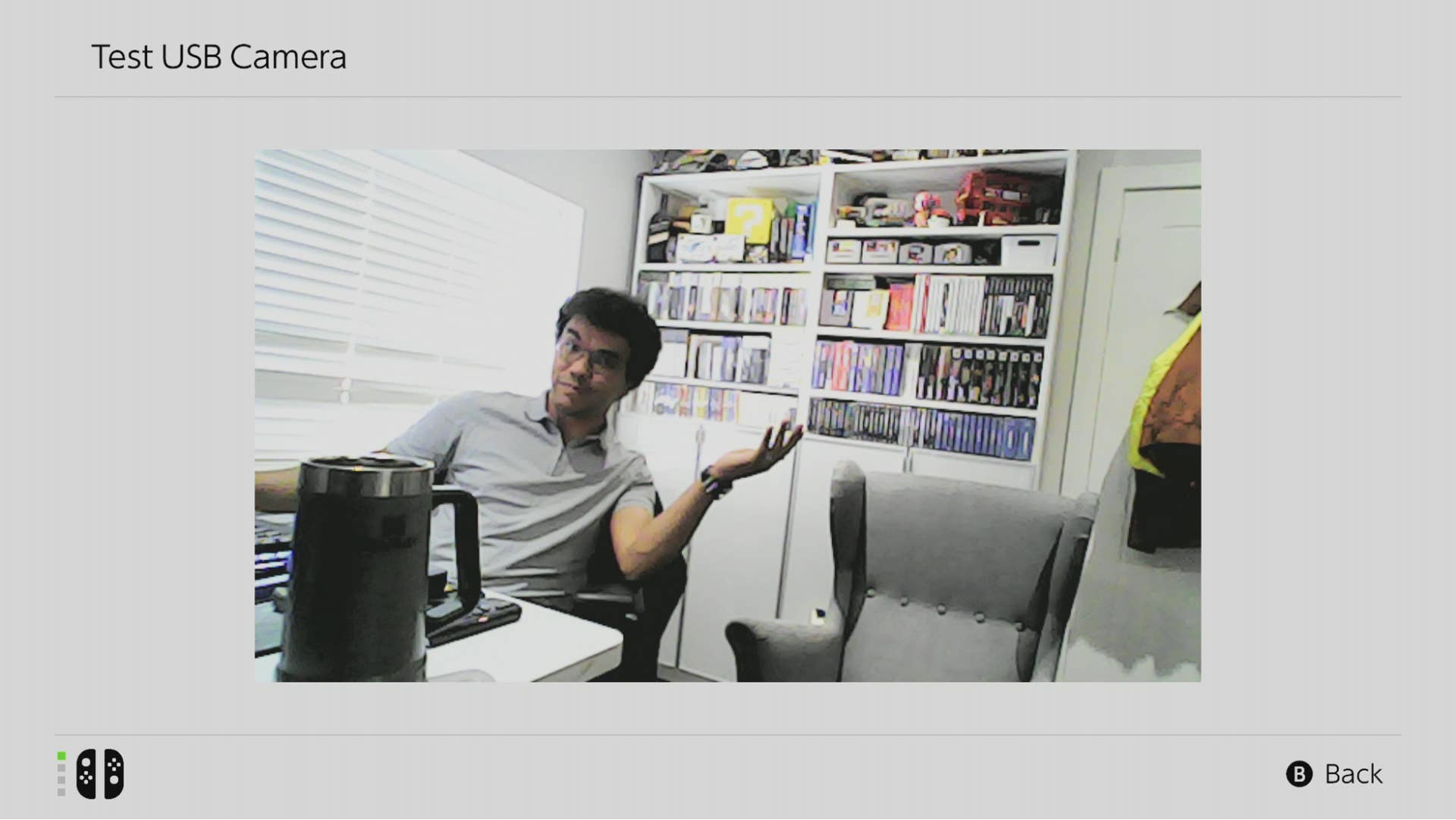 The author sits in his office in a closer, grainier shot taken using the Piranha Plant camera.