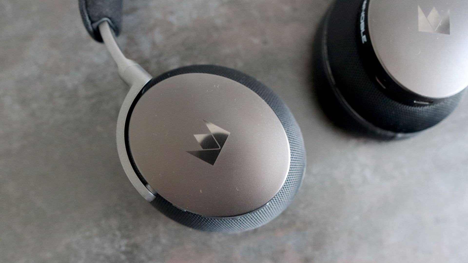 Noble Fokus Apollo headphones laid flat, with earcup closeup