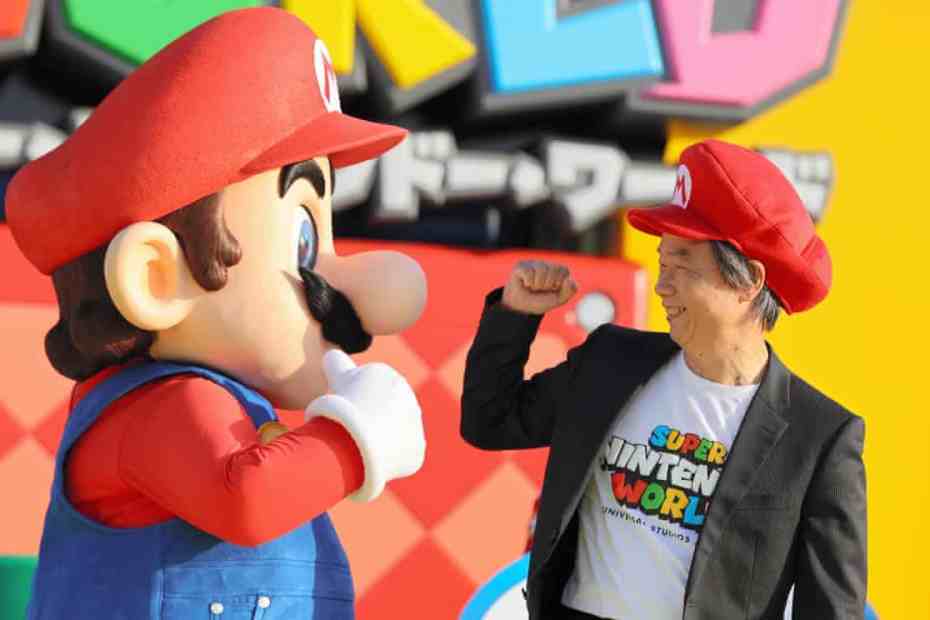 Miyamoto fist bumping Mario